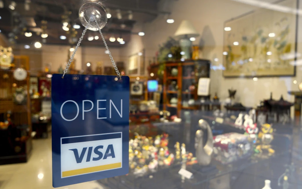 Open sign in a UK shop window